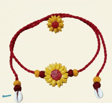 Bring a touch of sunshine to your look with this charming handmade floral jewellery set. Designed in a vibrant combination of deep red and bright yellow, each piece beautifully reflects warmth, joy, and traditional artistry.
The set features a stunning sunflower-inspired necklace with delicate threadwork, paired with matching earrings and handcrafted bangles that add a playful yet elegant finish. The soft texture and lightweight design make it comfortable for all-day wear, while the intricate floral detailing adds a graceful, festive appeal.
Perfect for cultural events, Haldi ceremonies, festive occasions, or even casual ethnic styling, this jewellery set effortlessly enhances your natural beauty with a fresh and lively charm.